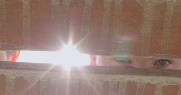 Childrens Eyes Cracks Wooden Boards Looking Camera Bright Glare Sunlight — Stock Video