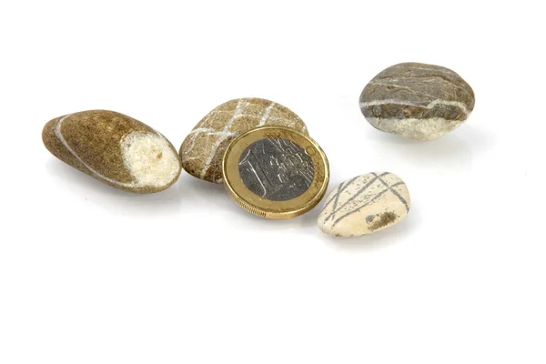 Pebbles and coin — Stock Photo, Image