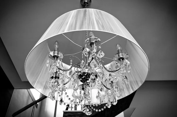 A crystal chandelier with a white shade — Stock Photo, Image