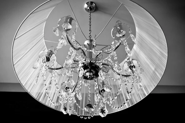 A crystal chandelier with a white shade — Stock Photo, Image