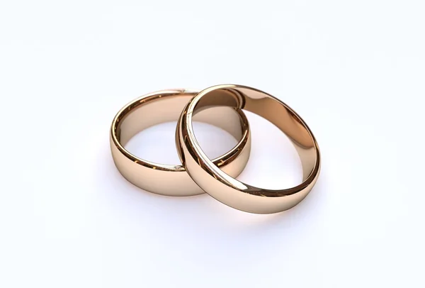 Couple of gold wedding rings on white background — Stock Photo, Image