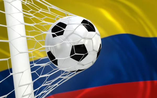 Colombia waving flag and soccer ball in goal net — Stock Photo, Image