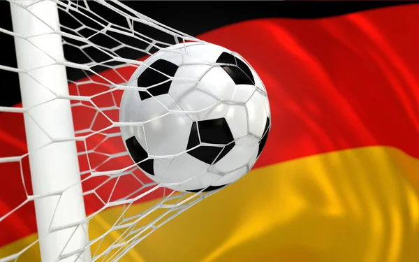 Allemagne agitant le drapeau et le ballon de football dans le filet de but — Photo