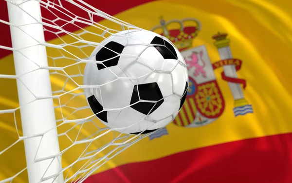 Spanje zwaaien vlag en voetbal bal in doel netto — Stockfoto