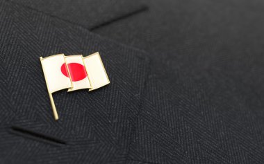 Japan flag lapel pin on the collar of a business suit clipart