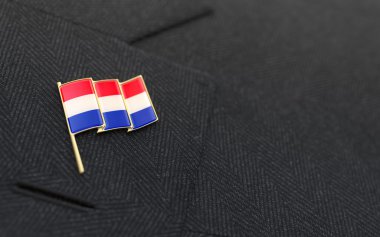 Netherlands flag lapel pin on the collar of a business suit clipart