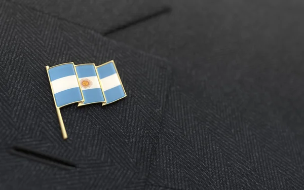 Argentina flag lapel pin on the collar of a business suit — Stock Photo, Image