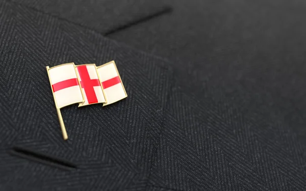 England flag lapel pin on the collar of a business suit — Stock Photo, Image