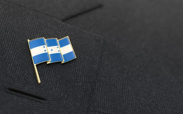 Honduras flag lapel pin on the collar of a business suit — Stock Photo, Image