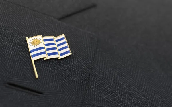 Uruguay flag lapel pin on the collar of a business suit — Stock Photo, Image