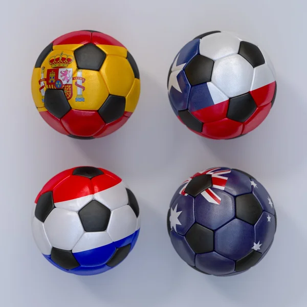 Soccer balls with flags of Spain, Australia, Netherlands, Chile — Stock Photo, Image