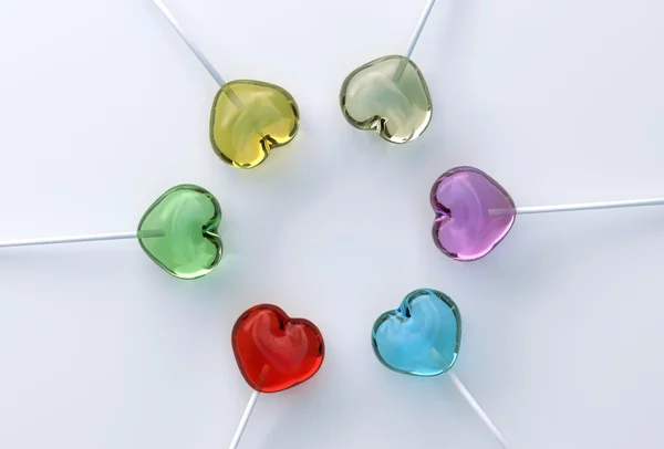 Multi colored heart shape lollypops — Stock Photo, Image
