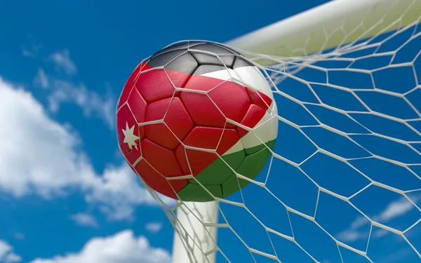Jordanië vlag en voetbal bal in doel netto — Stockfoto