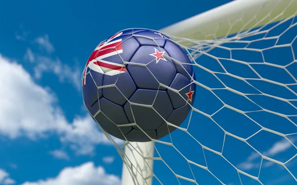 New Zealand flag and soccer ball in goal net — Stock Photo, Image