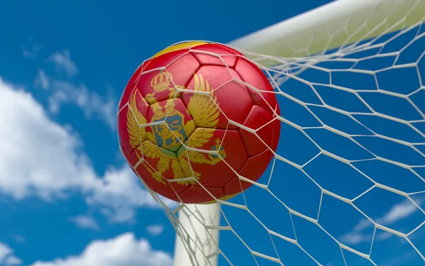 Montenegro flagga och fotboll boll i netto målet — Stockfoto