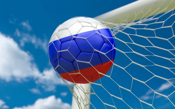 Russia flag and soccer ball in goal net — Stock Photo, Image
