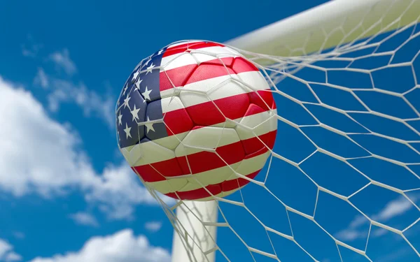 USA flag and soccer ball in goal net — Stock Photo, Image