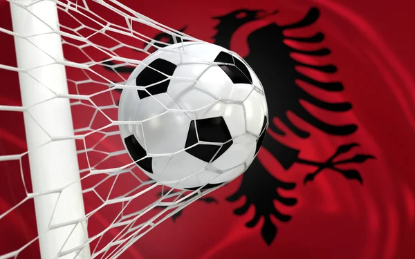Flag of Albania and soccer ball in goal net — Stock Photo, Image