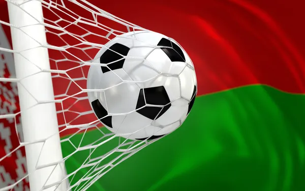 Vlag van Wit-Rusland en voetbal bal in doel netto — Stockfoto