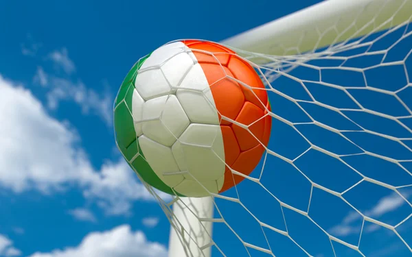 Flag of Ireland and soccer ball in goal net — Stock Photo, Image