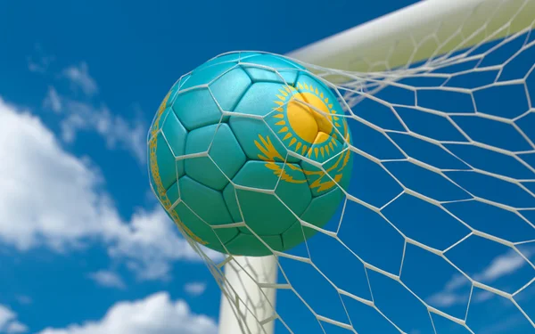 Flag of Kazakhstan and soccer ball in goal net — Stock Photo, Image