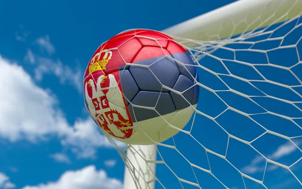 Flag of Serbia and soccer ball in goal net — Stock Photo, Image