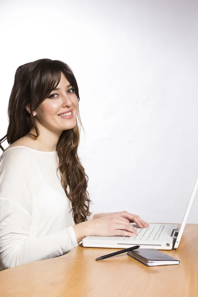 Young Brunette on a Laptop — Stock Photo, Image