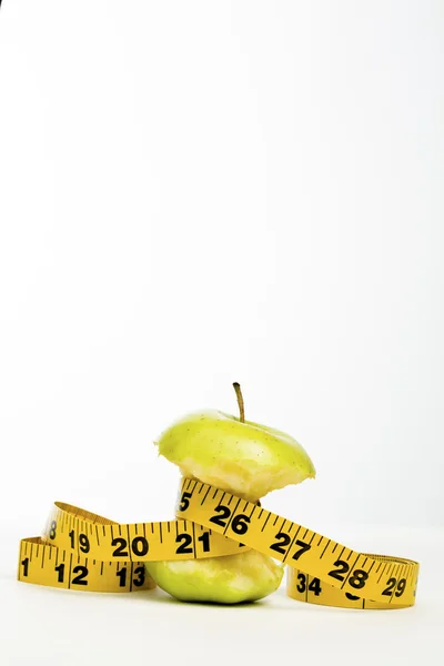 Green Apple Core with Tape Measure — Stock Photo, Image