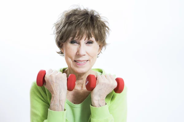 Mature Woman Exercising on a White Background — Stock Photo, Image