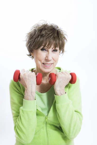 Mature Woman Exercising on a White Background — Stock Photo, Image