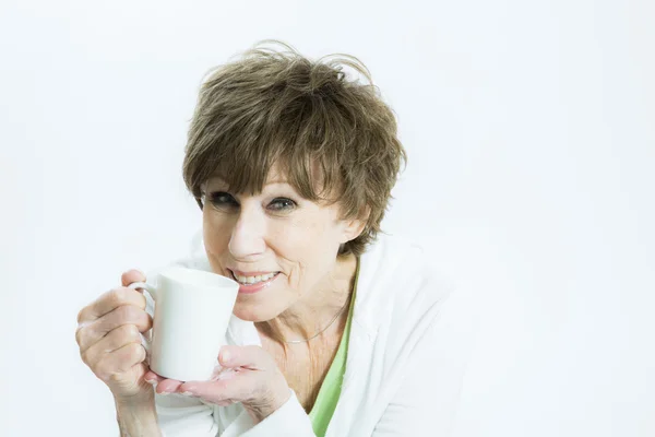 Mature Woman Holding a White Mug — Stock Photo, Image