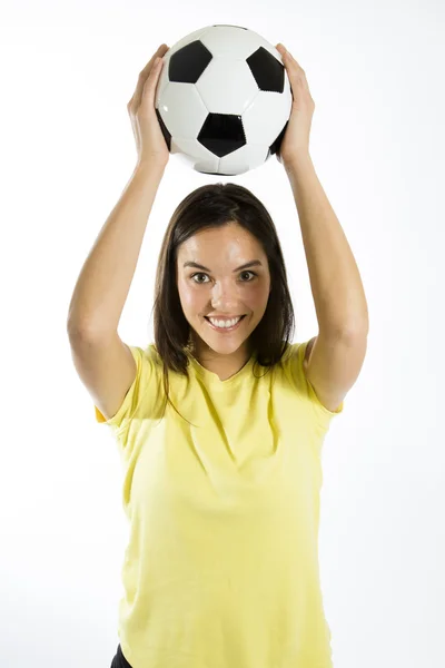 Jonge vrouw met een voetbal — Stockfoto