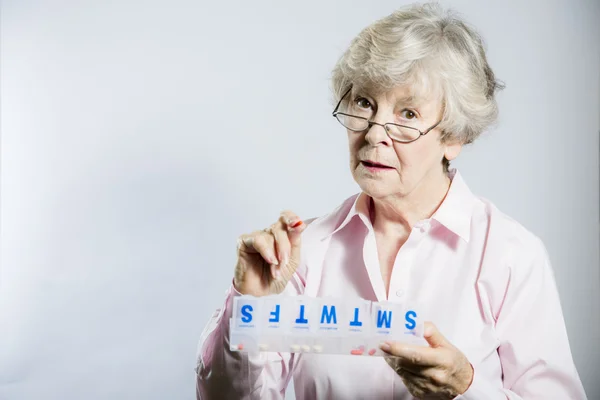 Elderly Woman Checking her Medication — Stock Photo, Image