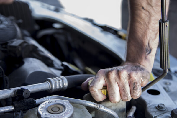 Mechanic Working on a Car