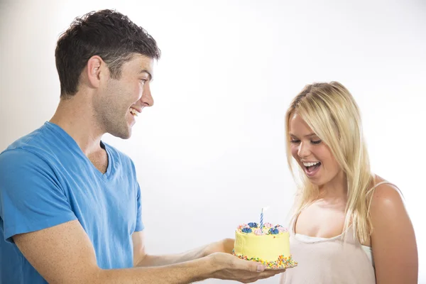 Man Giving a Birthday Cake to Girl