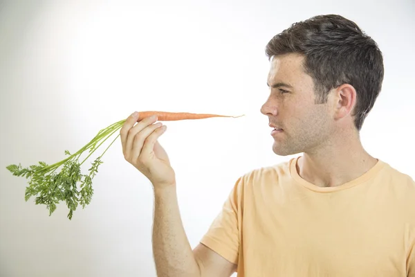 Man Holding a Carrot — Stock Photo, Image