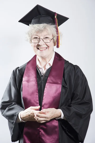 Пожилая женщина, окончившая колледж Стоковая Картинка