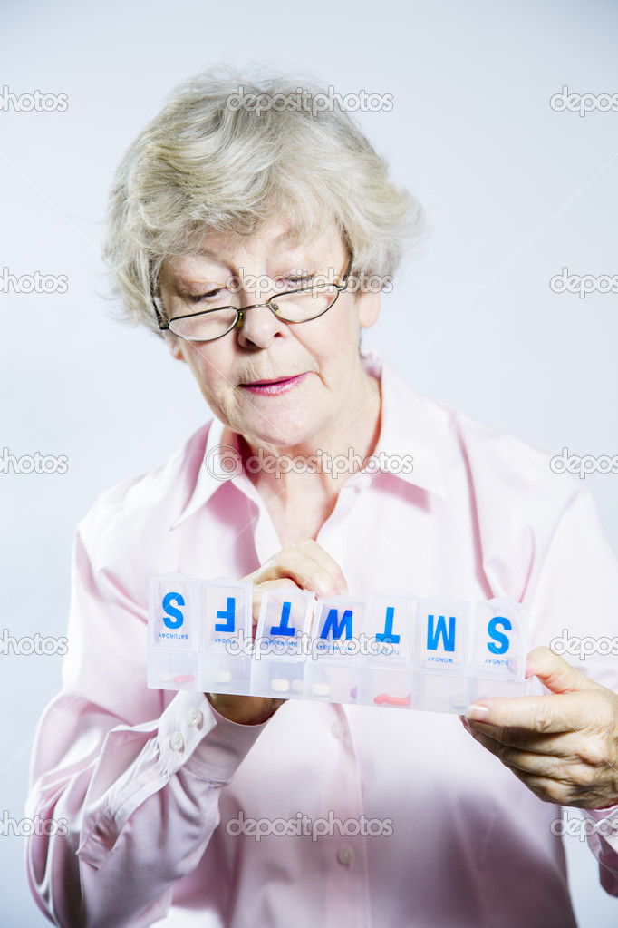 Elderly Woman Checking her Medication
