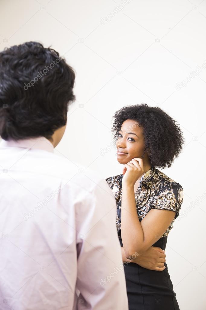 Man and Woman Having a Conversation at Work — Stock Photo © ZOOMYimages ...