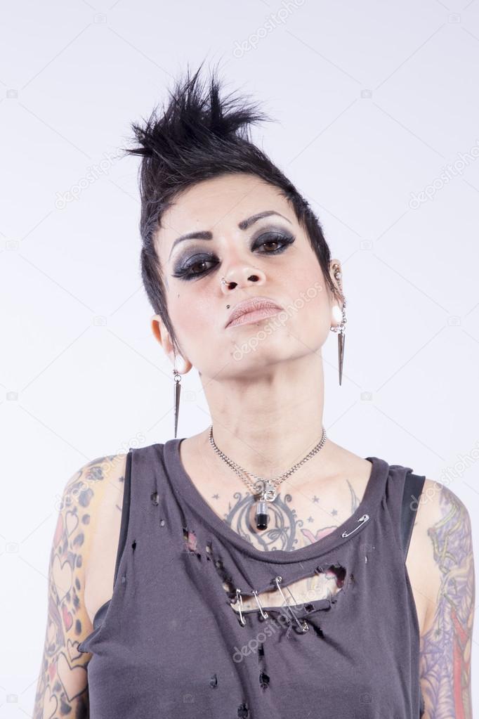 Young Girl With Tattoos on a White Background