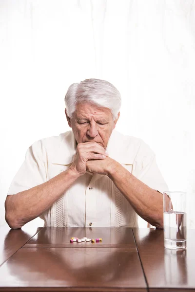 Elderly man with medication — Stock Photo, Image