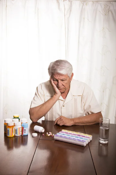 Elderly man with medication — Stock Photo, Image