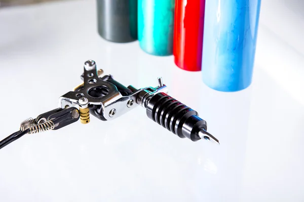 Tattoo gun and ink tubes — Stock Photo, Image