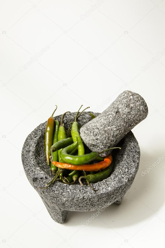 Peppers with a mortar and pestle