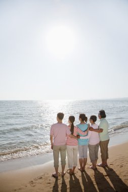 Family by the beach clipart
