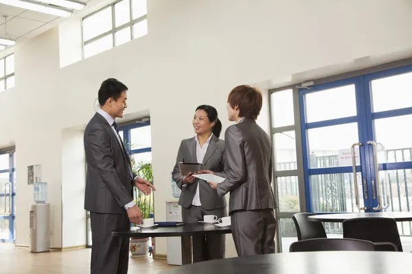 Business people meeting in company cafeteria — Stock Photo, Image