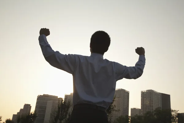 Businessman with fists in the air celebrating — Stock Photo, Image
