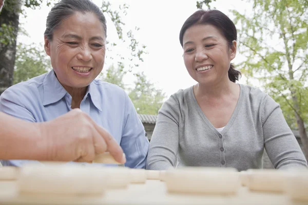 Mature women playing Chinese checkers — Stock Photo, Image