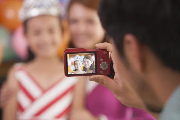 Father Taking a Picture of Mother and Daughter on Daughter's Birthday — Stock Photo, Image