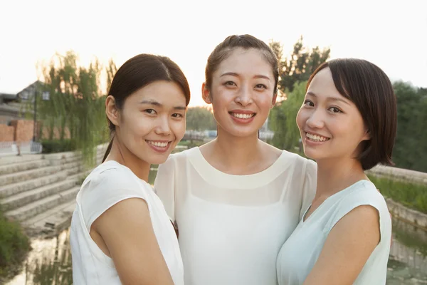 Three Friends Walking Across a Bridge — Stock Photo, Image